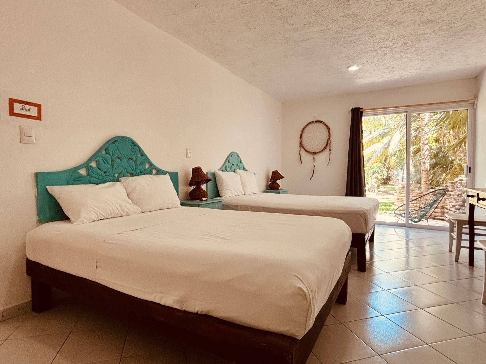 Hotel El Capitán Tulum: standard double room with two queen beds and a dreamcatcher
